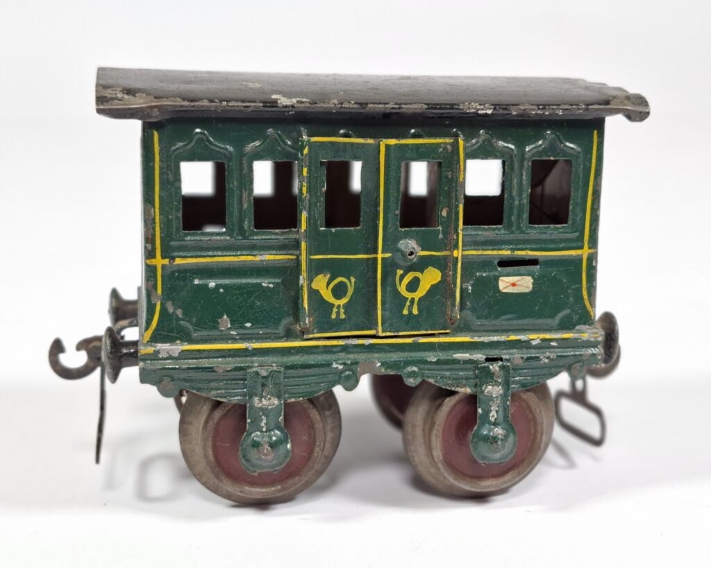 Early Marklin 1 gauge tinplate green mail car with hinged roof #1802, c.1900