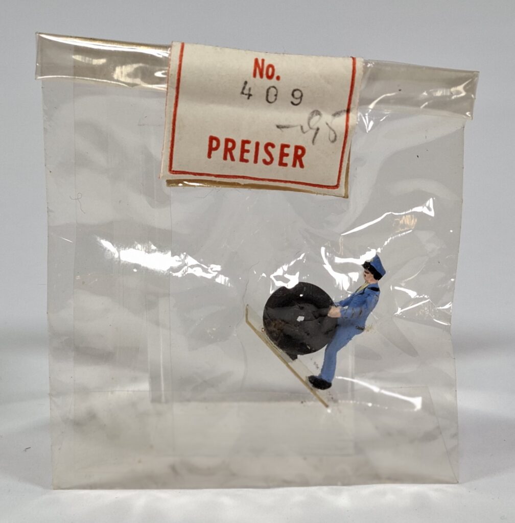 Preiser wooden figure #409 garage worker with tyre in original Cellon bag, c.1955