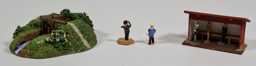 Preiser weir #1074 and 2 wooden figures; MMM bus stop with metal figures, c.1956