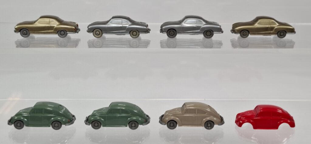 Wiking unglazed VW Beetle and Ghia model car lot, mid-1950s