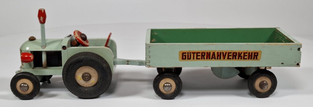 Vintage DDR wooden toy tractor with trailer, approx. 50 cm long, 1960s